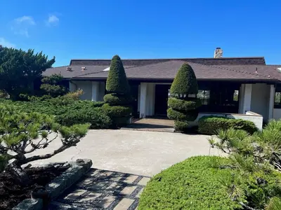 a house with trees and bushes in front of it at Spacious 4BD, La Jolla, Ocean Views, Jacuzzi in San Diego
