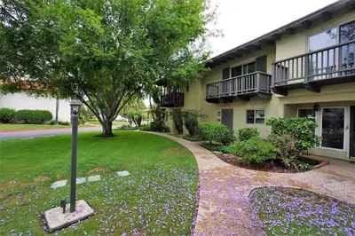 a building with a walkway in front of a house at Spanish Style San Diego Home Near Beaches in San Diego