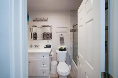 a bathroom with a toilet and a sink and a shower at La Jolla Lifestyle in San Diego