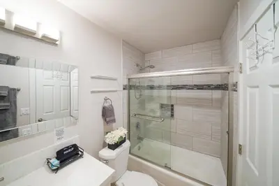 a bathroom with a shower and a toilet and a sink at La Jolla Lifestyle in San Diego