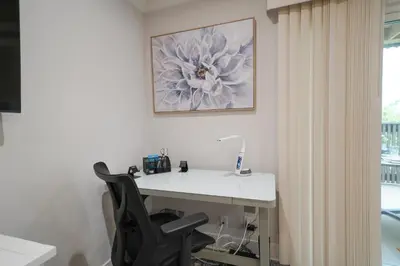 an office with a desk with a chair and a picture at La Jolla Lifestyle in San Diego