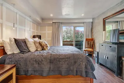 a bedroom with a bed and a television in it at Luxury Condo Resort Amenities - Pool, Pickleball in San Diego