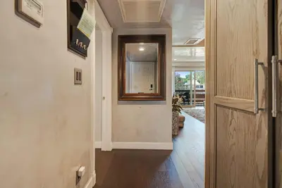a hallway of a home with a door and a window at Luxury Condo Resort Amenities - Pool, Pickleball in San Diego