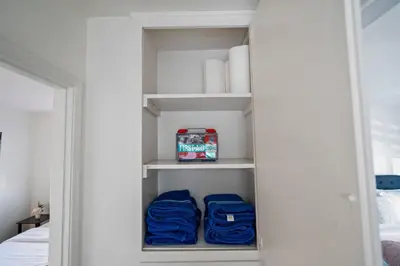 a closet with blue bags and a box in it at 3BR Family Fun Home, Pool, Air Hockey&Patio Dining in Chula Vista