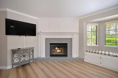 a living room with a fireplace and a flat screen tv at Casa Fuerte - Valley Estate w Pool Hot Tub Sports Court in Temecula