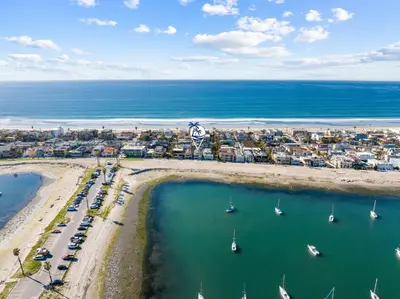 an aerial view of a beach with boats in the water at Cozy 2BR Bayfront Home | Patio + Water Views in Mission Beach in San Diego