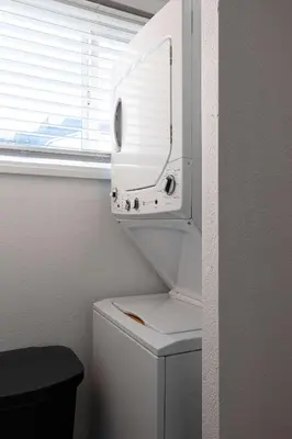 a white toilet in a bathroom with a window at Walk to Balboa and Zoo Central Renovated Villa in San Diego