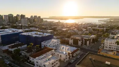 an aerial view of a city with buildings and the sunset at Walk to Balboa and Zoo Central Renovated Villa in San Diego