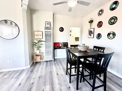 a dining room with a table and chairs at A Walkable Music-Themed Escape Near Downtown in San Diego