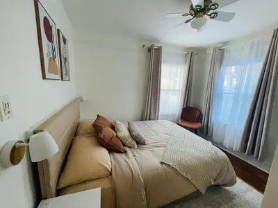 a bedroom with a bed and a ceiling fan at The North Park Stay in San Diego in San Diego