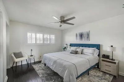 a bedroom with a bed and a ceiling fan at Marina Del Mar 203A in Oceanside