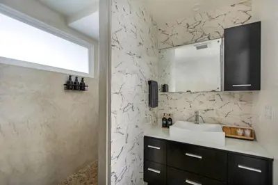 a bathroom with a sink and a mirror at Marina Del Mar 203A in Oceanside