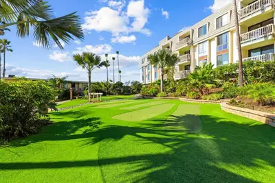 a golf course in front of a building at Beachfront Resort-sunset views deck & luxe king in Oceanside