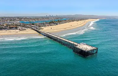 an aerial view of a beach and a pier at Coastal 4Br Retreat, Just Steps From 44Th St Beach in Newport Beach