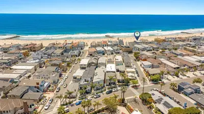 an aerial view of a city and the beach at 3Br Oceanfront Home W Balcony Right Over The Sand By Beachview Rentals in Newport Beach