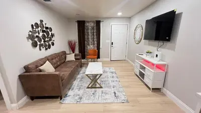 a living room with a couch and a flat screen tv at 321 W Park 2Bed 1Bath Unit A by SD Stay in El Cajon