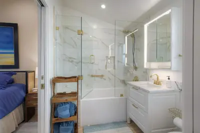 a bathroom with a shower and a sink and a tub at Monarch Cove - Unit C For 4ppl in Oceanside