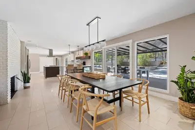 a dining room with a table and chairs at Mt. Helix Resort+ Pool/Spa, Pickleball, Amenities! in La Mesa
