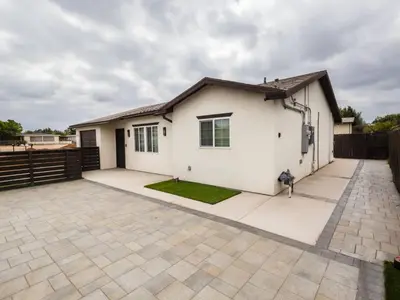 a white house with a fence at Escondido Front Unit 3-BR by SD STAY in Escondido