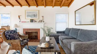 a living room with a couch and a table at Oceanfront Atelier by AvantStay Beachfront Balboa Peninsula Escape in Newport Beach