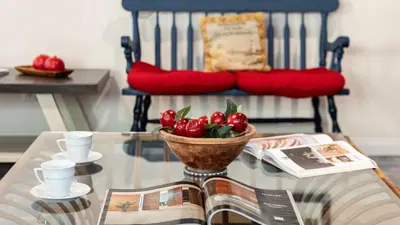 a table with a bowl of tomatoes on top of it at Oceanfront Atelier by AvantStay Beachfront Balboa Peninsula Escape in Newport Beach