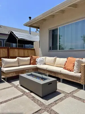 a couch and a coffee table on a patio at Light & Airy by Coastline Vacation Rentals in San Diego
