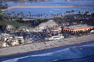 an aerial view of a beach with a crowd of people at The Seabreeze by Coastline Vacation Rentals in San Diego