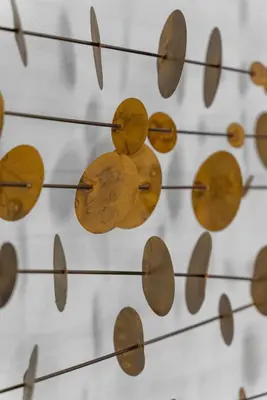 a bunch of wooden clocks on a wall at Serena Encinitas by Coastline Vacation Rentals in Encinitas