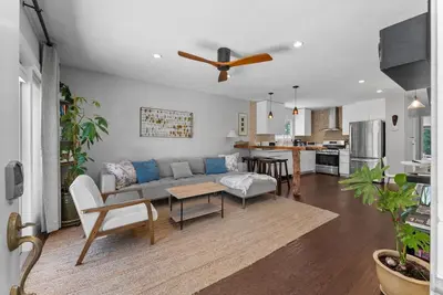 a living room with a couch and a table at Serena Encinitas by Coastline Vacation Rentals in Encinitas