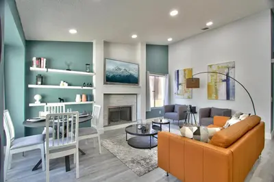 a living room with a couch and a table at Modern Design Temecula House-30 in Temecula