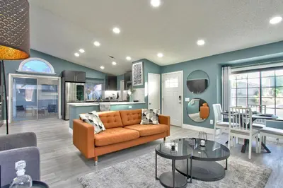 a living room with a couch and a table at Modern Design Temecula House-30 in Temecula