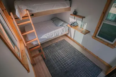 an overhead view of a bedroom with a bunk bed and a ladder at Off-Grid Tiny Home Pacific Views & Serenity in Pauma Valley