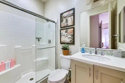 a bathroom with a shower and a toilet and a sink at 1 Mi to Beach! San Clemente Gem with Rooftop Patios in San Clemente