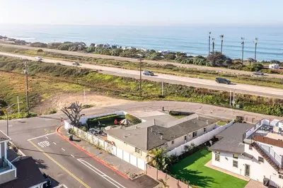 an aerial view of a house with the ocean in the background at Walk To Ponto Beach - Surf and Relax in Carlsbad