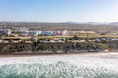 an aerial view of a beach with a speed limit sign at Walk To Ponto Beach - Surf and Relax in Carlsbad