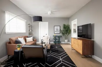 a living room with a couch and a table at The Urban Den by Coastline Vacation Rentals in San Diego