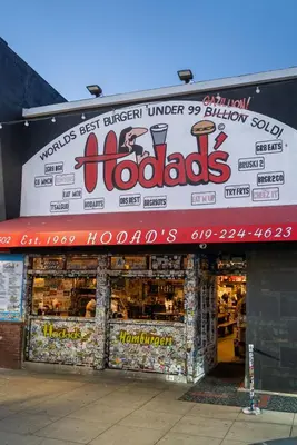 a store front of a store with a sign at Nomad Surf Lounge by Coastline Vacation Rentals in San Diego