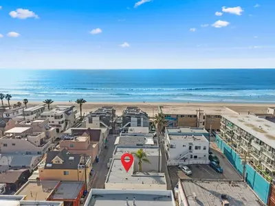 an aerial view of a city with a beach at The Sands by Coastline Vacation Rentals in San Diego