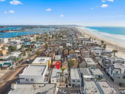 an aerial view of a city and the beach at The Sands by Coastline Vacation Rentals in San Diego