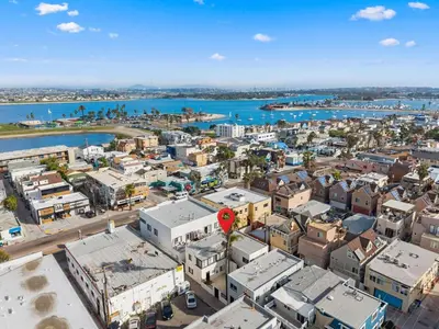 an aerial view of a city with a red marker at The Sands by Coastline Vacation Rentals in San Diego