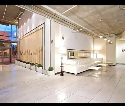 a large room with a white bed and a large painting at Spacious 3bed Apt with pool close to SDCC in San Diego