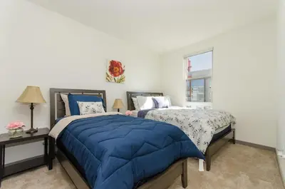 a bedroom with two beds and a window at Snazzy 2BR Near Petco Park & Convention Center in San Diego