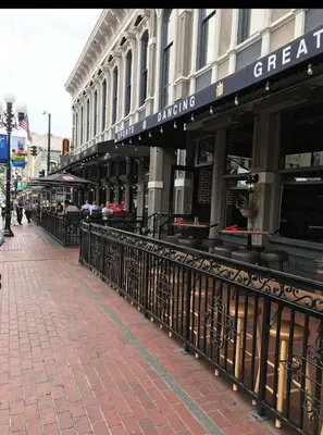 a building on a city street with a fence at Snazzy 2BR Near Petco Park & Convention Center in San Diego