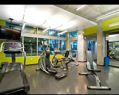 a gym with treadmills and elliptical machines at Snazzy 2BR Near Petco Park & Convention Center in San Diego