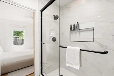 a bathroom with a shower with a glass door at Cliff View - Prime Downtown La Jolla in San Diego