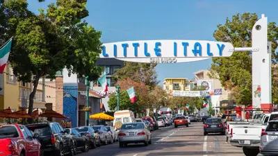 a street sign for little italy on a busy city street at Entire Private Home with 3 Bedrooms 2 Bathrooms, Ranch Style w Gated Yard near Beach, Available Now in Imperial Beach