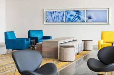 a waiting room with chairs and a table at SpringHill Suites by Marriott San Diego Downtown/Bayfront in San Diego
