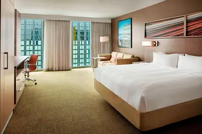 a hotel room with a large bed and a desk at Residence Inn by Marriott San Diego Downtown/Bayfront in San Diego