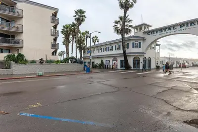 an empty street in front of a building at Pier-View Penthouse Condo in Pacific Beach in San Diego