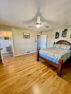 a bedroom with a bed and a ceiling fan at Large Group getaway to all of San Diego's Best in La Mesa